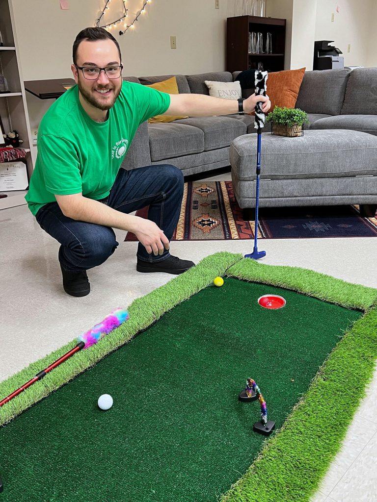Bergen Community College Phi Theta Kappa student Matthew Paccione worked with his peers to develop the sensory mini-golf course for adults with intellectual disabilities.
