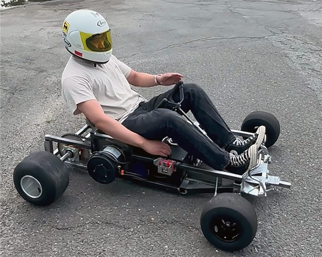 Bergen alumna Richard Boada (’23) driving an electric-powered go-kart his team created.